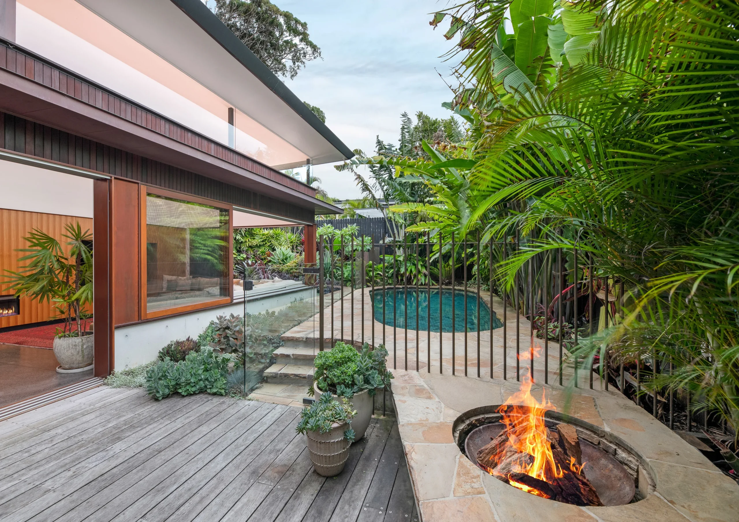 Pool and fire pit of a property in Avalon Beach, Sydney designed by Northern Rivers architects Markham Lee.