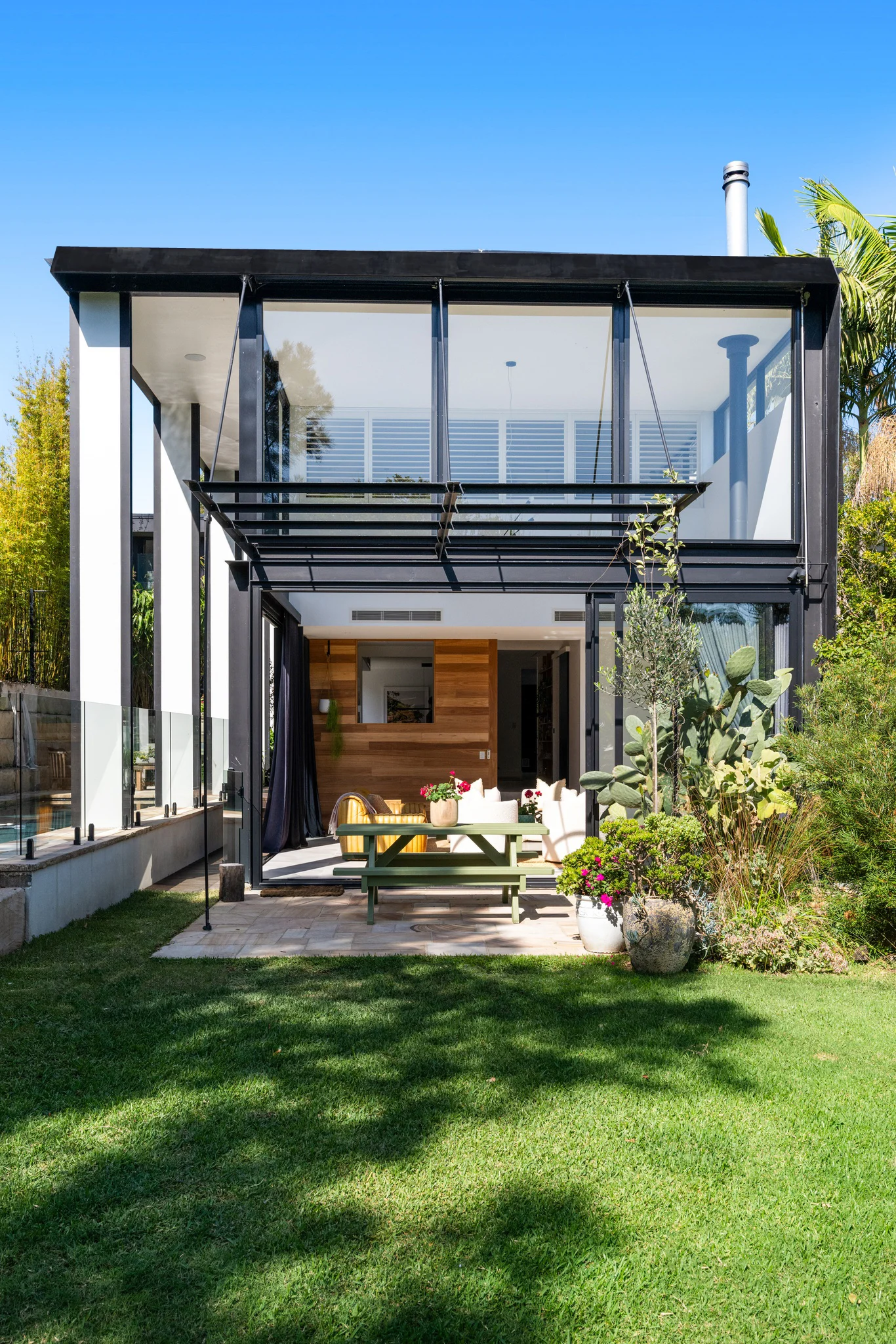 Rear patio of a property in Palm Beach, Sydney designed by Avalon Beach architects Markham Lee.
