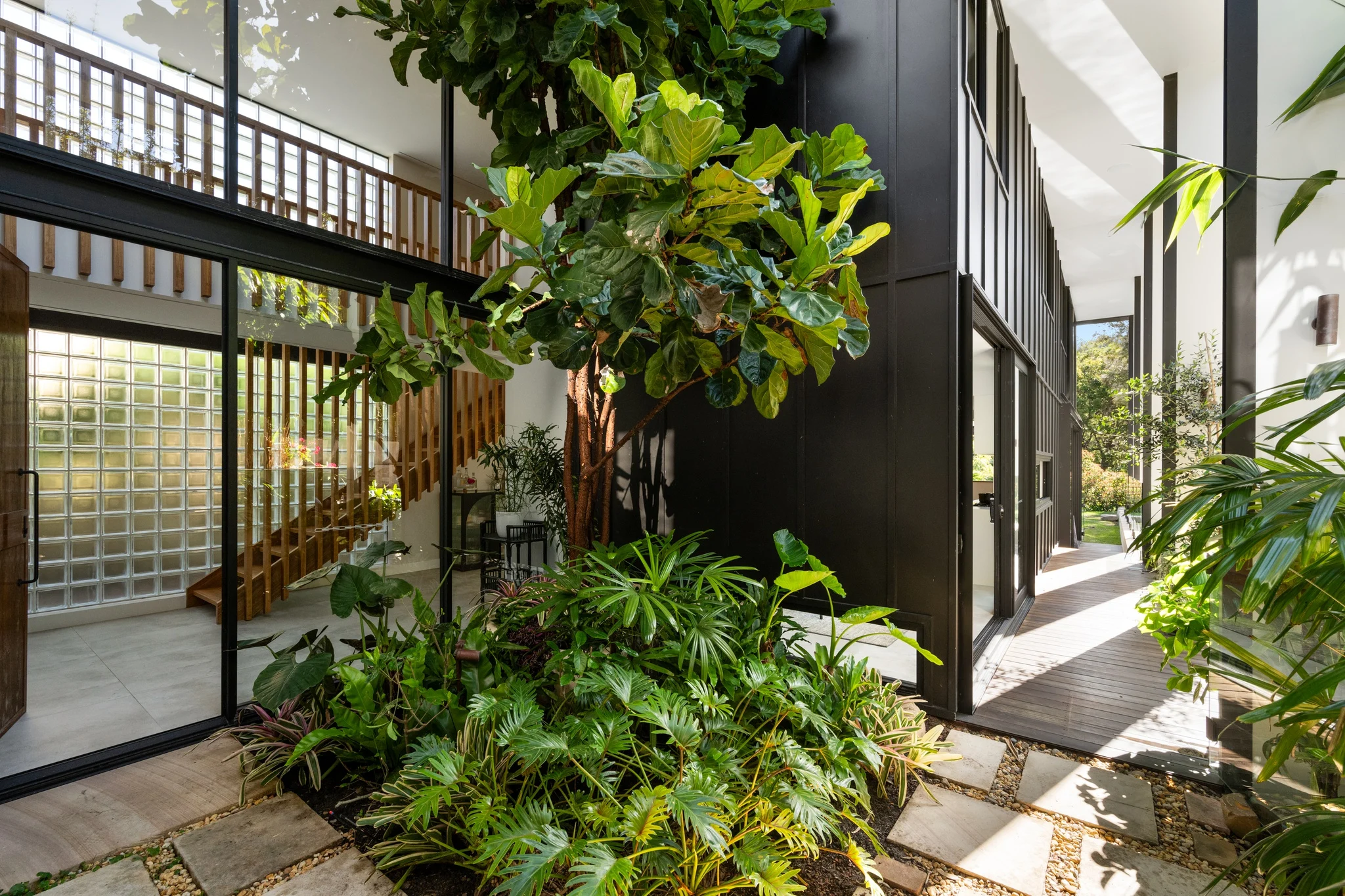 Exterior with garden of a property in Palm Beach, Sydney designed by Avalon Beach architects Markham Lee.