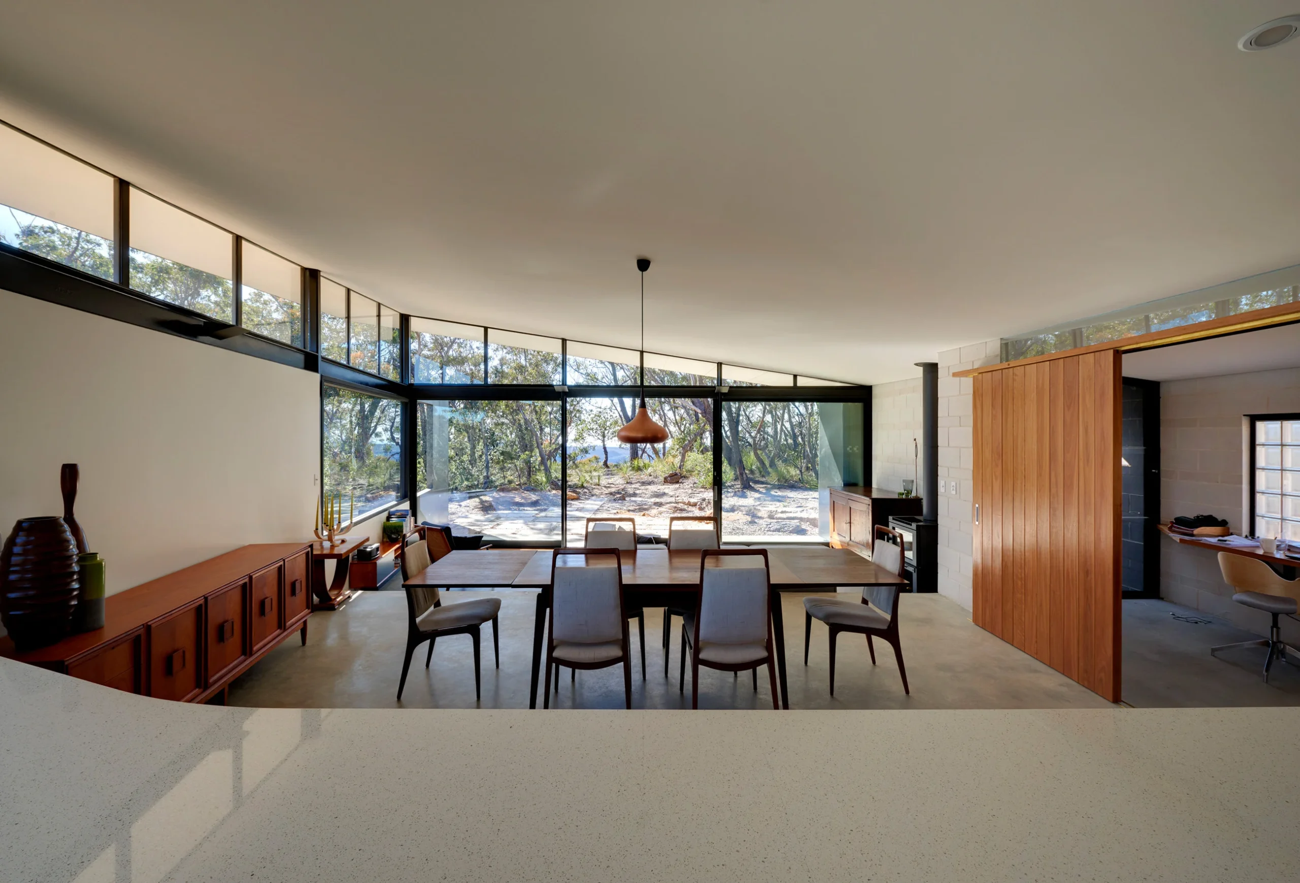 Dining room of a bushfire-proof property in Leura, Blue Mountains designed by Northern Beaches architects Markham Lee.