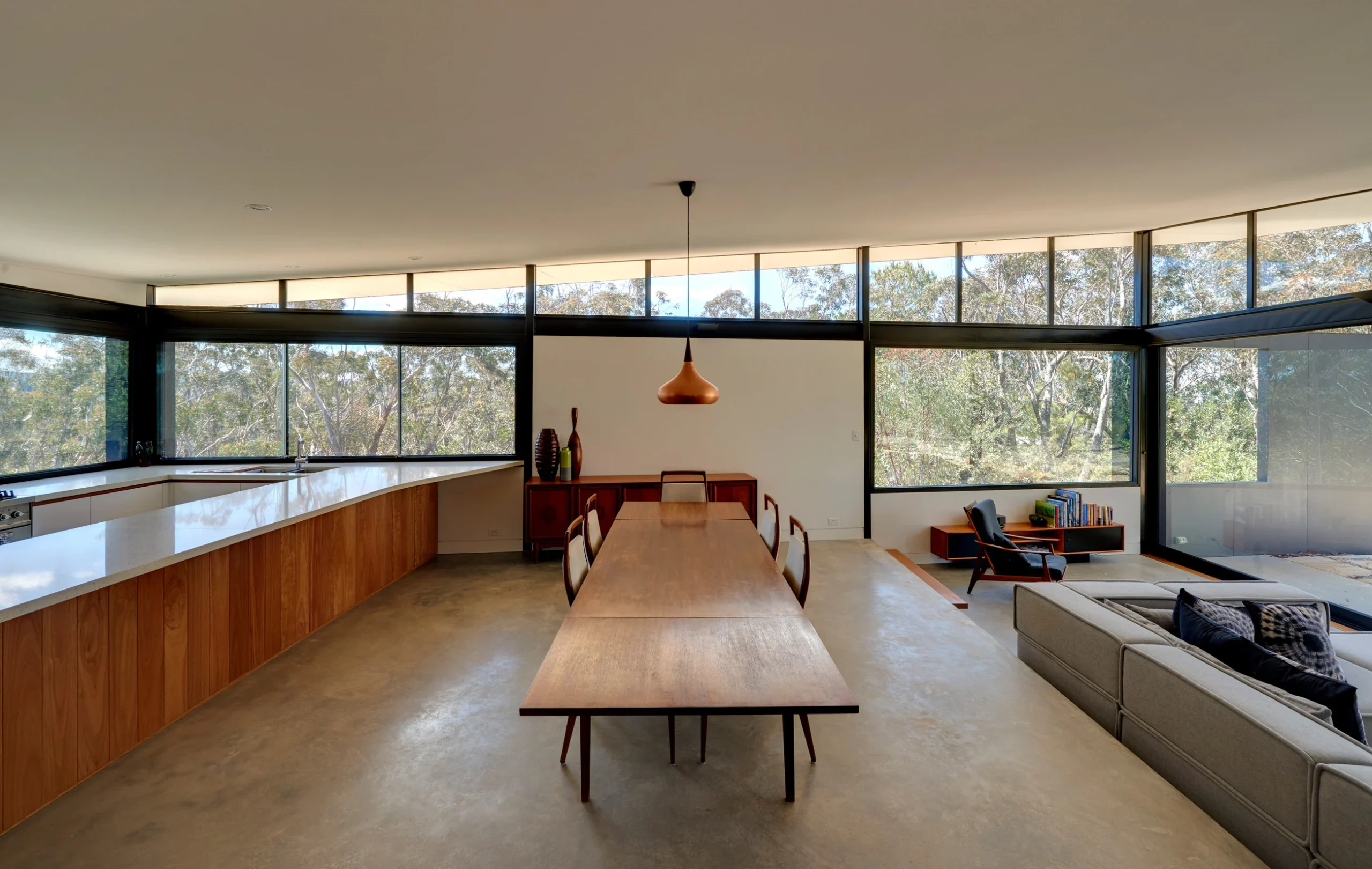 Dining room of a bushfire-proof property in Leura, Blue Mountains designed by Northern Beaches architects Markham Lee.